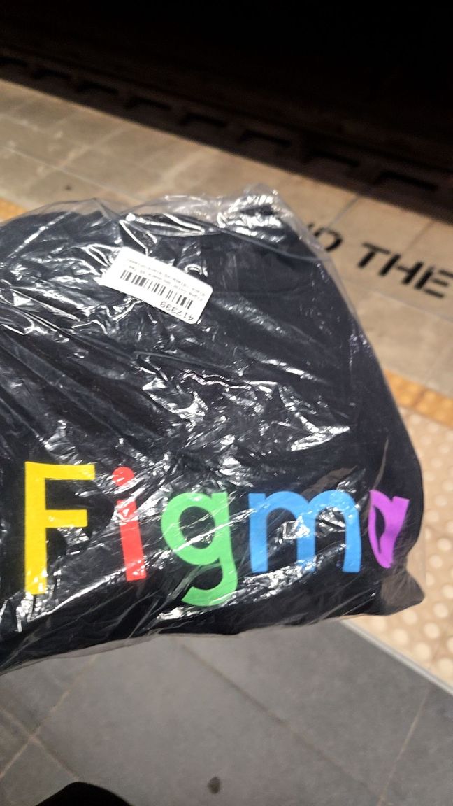 Black t-shirt with the word Figma written in rainbow colours.